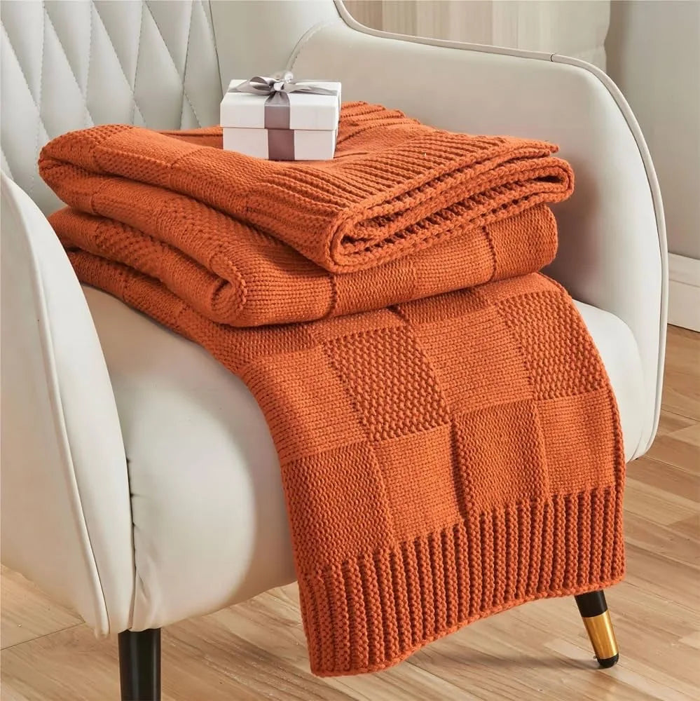 Couverture tricotée en laine orange