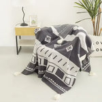 Couverture canapé en tricot - Vignette | Couvertures Cosy