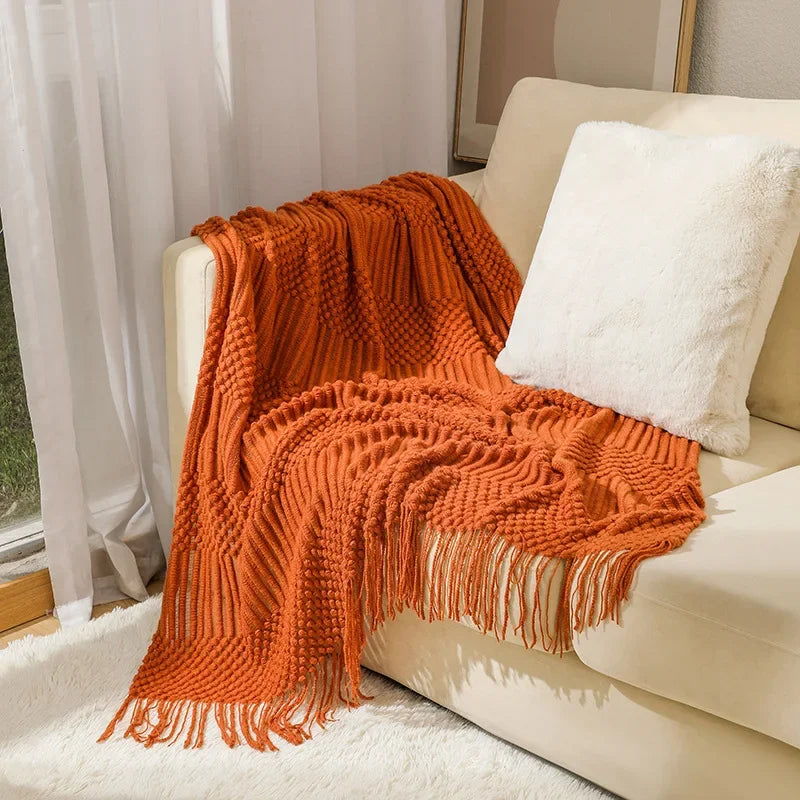 Couverture décoration orange sur canapé
