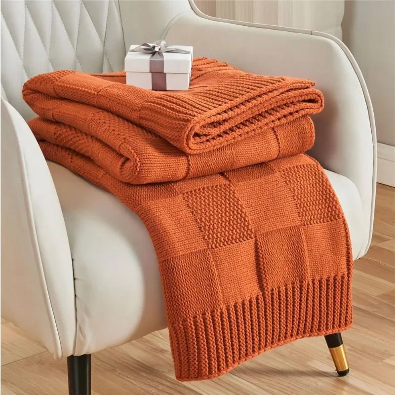 Couverture tricotée en laine orange