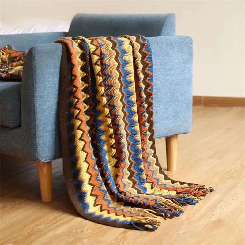 Couverture tricotée à la main avec pompon